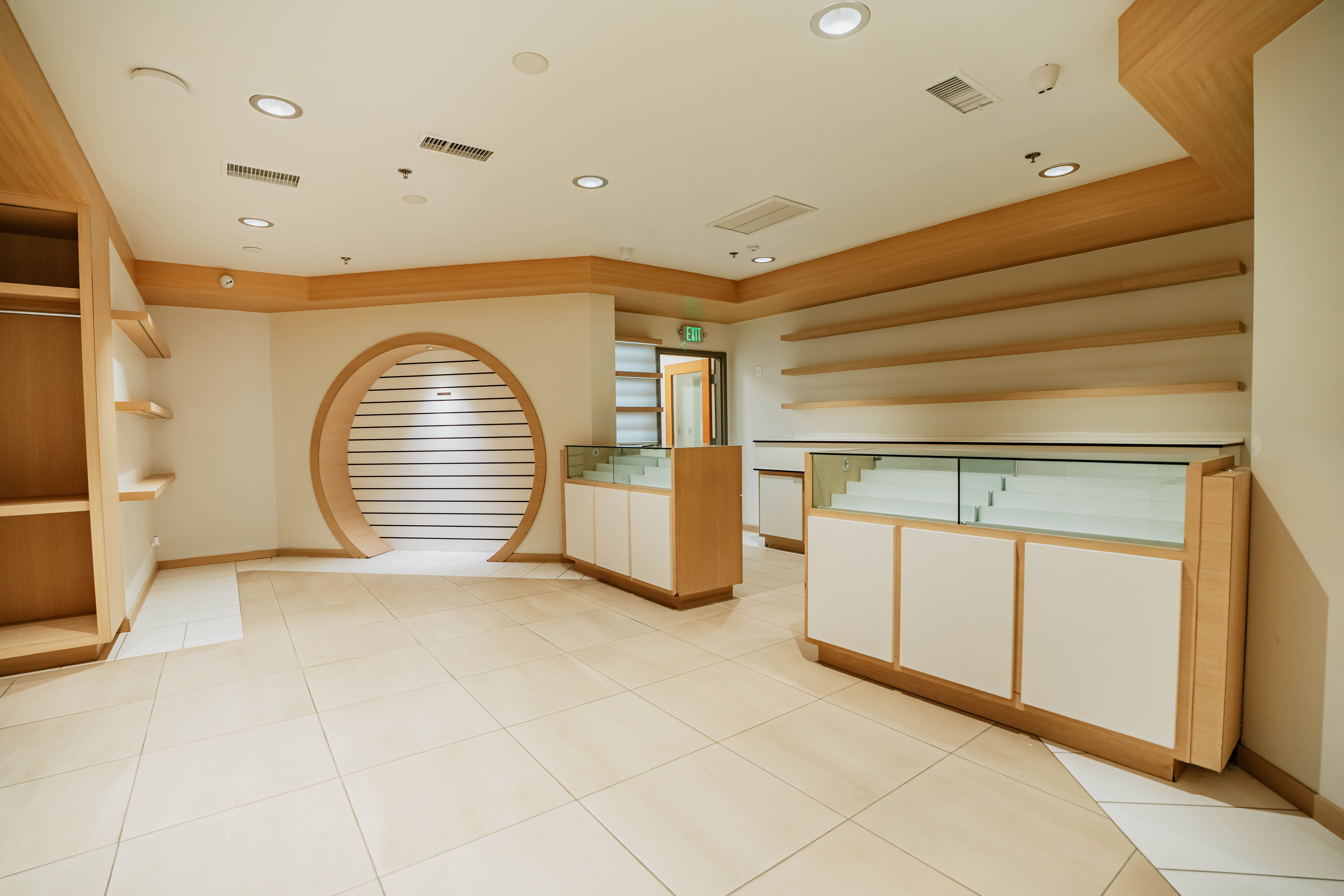 Display cases and circular wood wall feature
